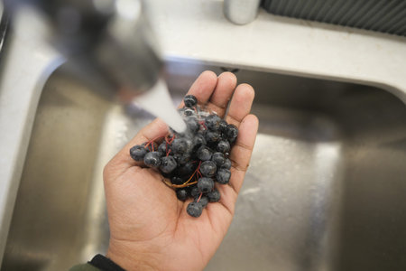 Washing blueberries in the sink