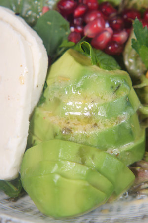 closeup of slice of avocado on a plateの写真素材