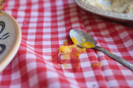 Messy table with spilled food during a casual meal gatheringの写真素材
