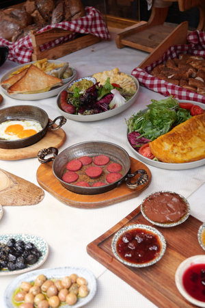 Delicious spread of turkish breakfast dishes on a tableの写真素材