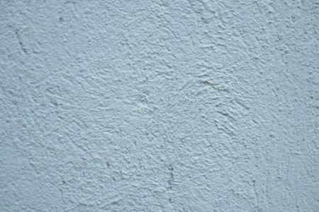 Textured blue wall surface with unique patterns and tonesの写真素材