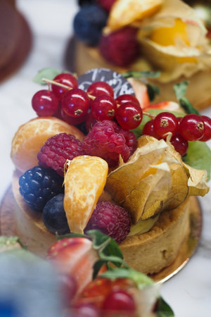 Berry citrus fruit tart on displayの写真素材