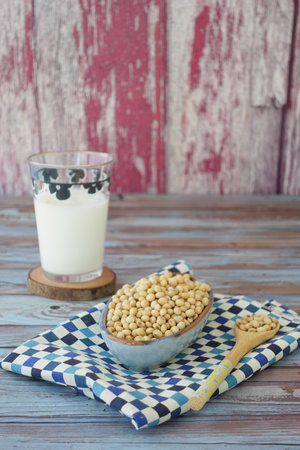 soya beans and glass of milk on tableの写真素材