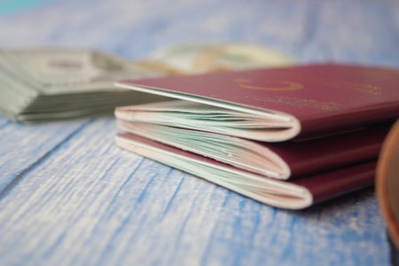 Travel preparations with passports and cash on a table