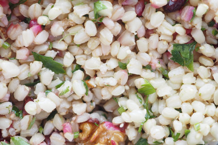 Healthy grain salad filled with fresh herbs and nutsの写真素材