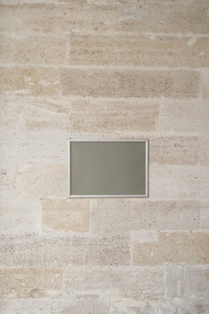 Minimalist wall with a blank frame in a serene interiorの写真素材
