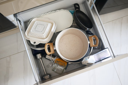 Kitchen drawer with various utensils and tools