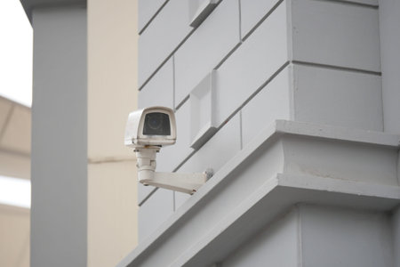 Security camera mounted on a modern building wall