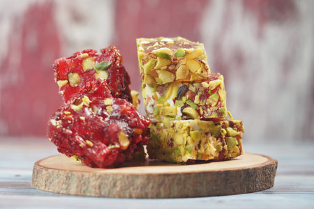 Colorful turkish delight on wooden tableの写真素材