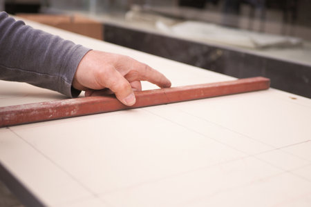 Crafting precision on a woodworking project at a workshopの写真素材