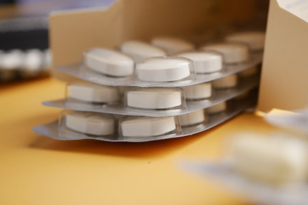 Close-Up of Person Inserting a Soft Foam Earplug into the Earの写真素材