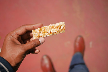 Snack time with a crunchy bar made of nuts