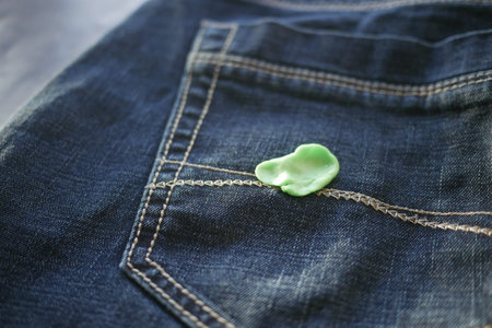 Chewing gum stuck on denim jeans pocket