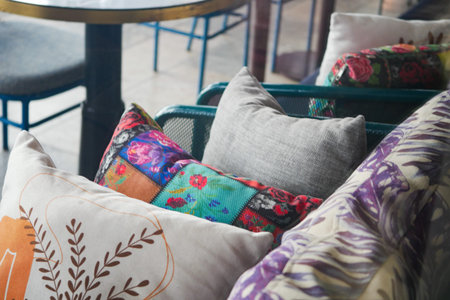 Comfortable seating area with decorative pillows in a cafe