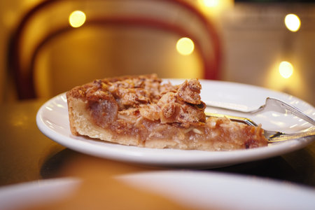 Delicious slice of pie served on a white plate