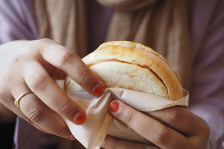 Delicious bread roll enjoyed at a cozy cafe during afternoonの写真素材