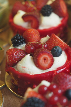 Delicious dessert with fresh berries and cream toppingの写真素材