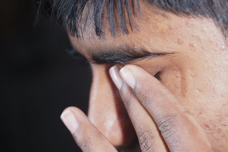 Young individual showing signs of stress or fatigue