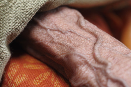 Close-up of a hand showcasing age and texture detailsの写真素材