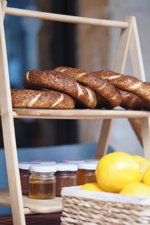 Fresh baked turkish simit and honey display at local market