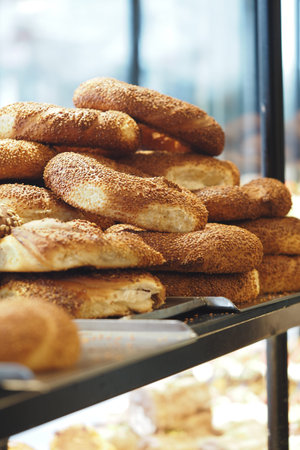 Freshly baked bread rolls on display in a bakery shop