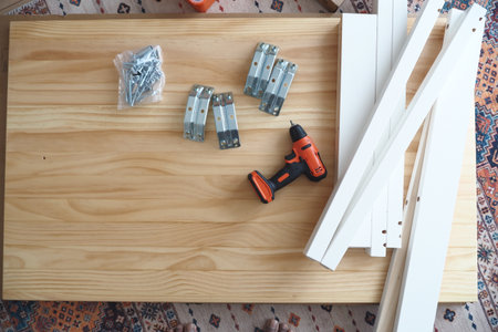 Building a wooden furniture piece with tools and materialsの写真素材