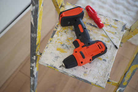 Battery powered drill and tools on a work platformの写真素材