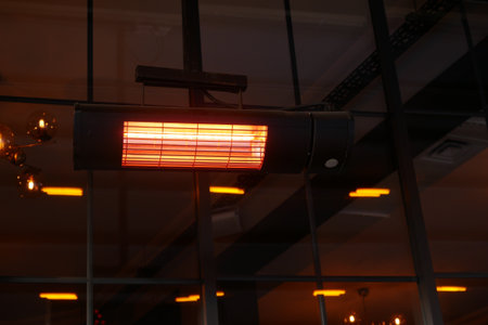 Modern infrared heater warming a stylish indoor spaceの写真素材