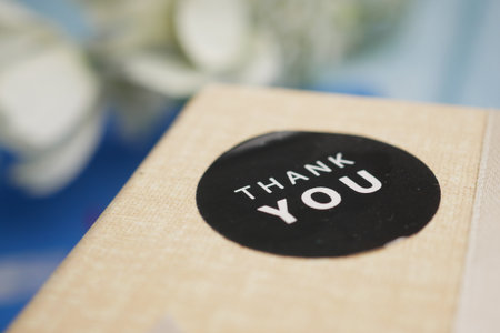 Surprise package with a thank you sticker on the lidの写真素材