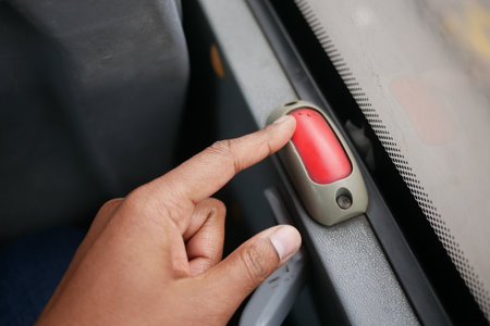 Passenger signals to stop bus with red buttonの写真素材