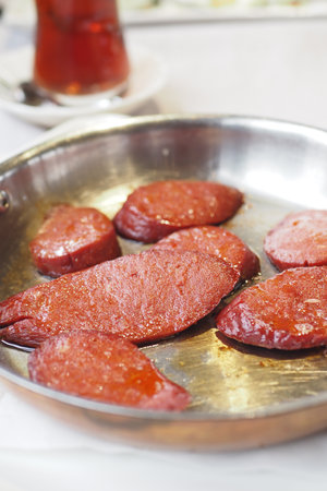 Sizzling sausages served in a classic metal panの写真素材