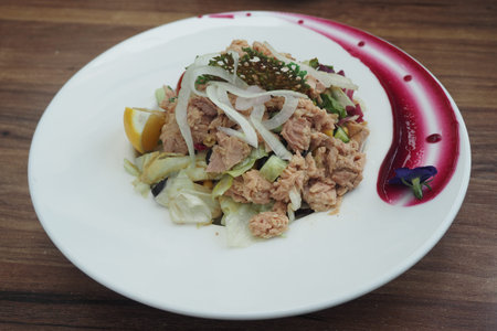 Fresh tuna salad served on a decorative plate