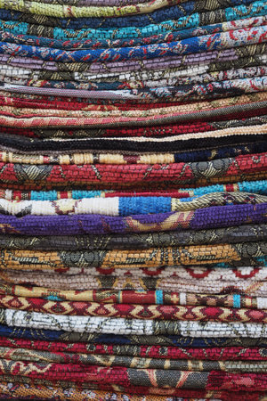 Textiles displayed at a craft market in a vibrant settingの写真素材