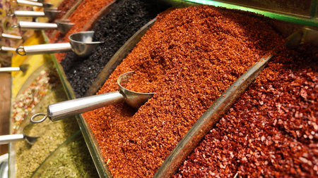 Colorful spices displayed at a market in the afternoonの写真素材