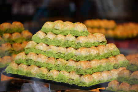 Sweet pyramid of baklava displayed in shop windowの写真素材