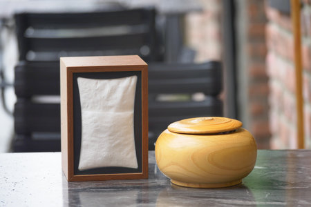 Container and napkin holder on outdoor table in cafeの写真素材