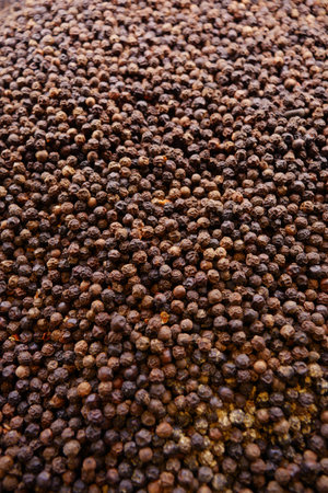 Varieties of black pepper in a market displayの写真素材