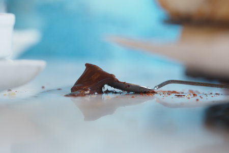 chocolate spilled on a table after a mealの写真素材