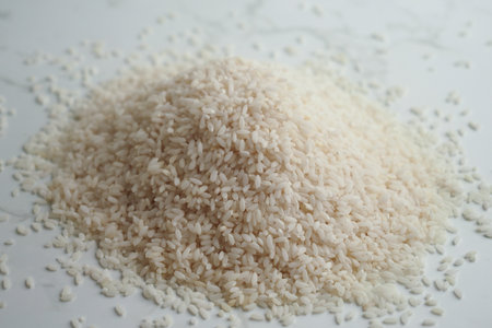 White rice piled on a clean kitchen surfaceの写真素材