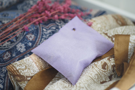 Lavender sachet on patterned fabric with flowersの写真素材
