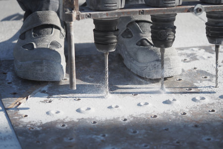 Drilling process with multiple tools on construction siteの写真素材