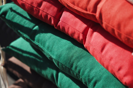 Colorful stack of outdoor cushions in bright shadesの写真素材