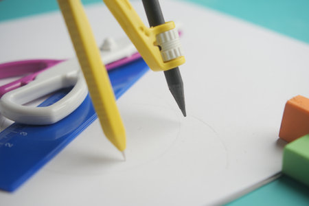 Tools are arranged for drawing and measuring on paperの写真素材