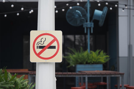 No smoking sign in outdoor cafe area during daytimeの写真素材