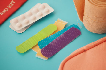 First aid supplies on a blue surface for emergency careの写真素材