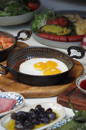Breakfast with fresh eggs in a traditional panの写真素材