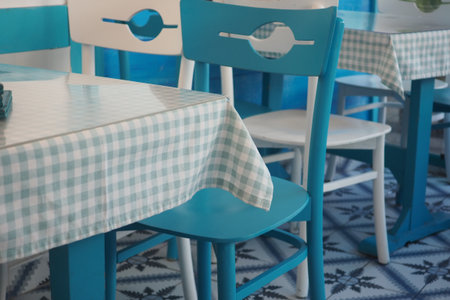 Charming cafe seating arrangement with blue accentsの写真素材