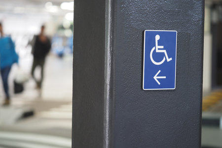 Parking sign indicating accessible space in busy areaの写真素材