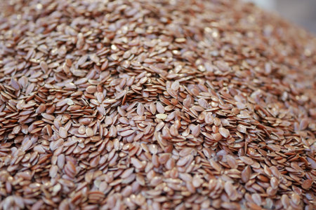 Flax seeds displayed in bulk at a market settingの写真素材