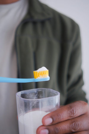 Brushing teeth with a toothbrush and soda